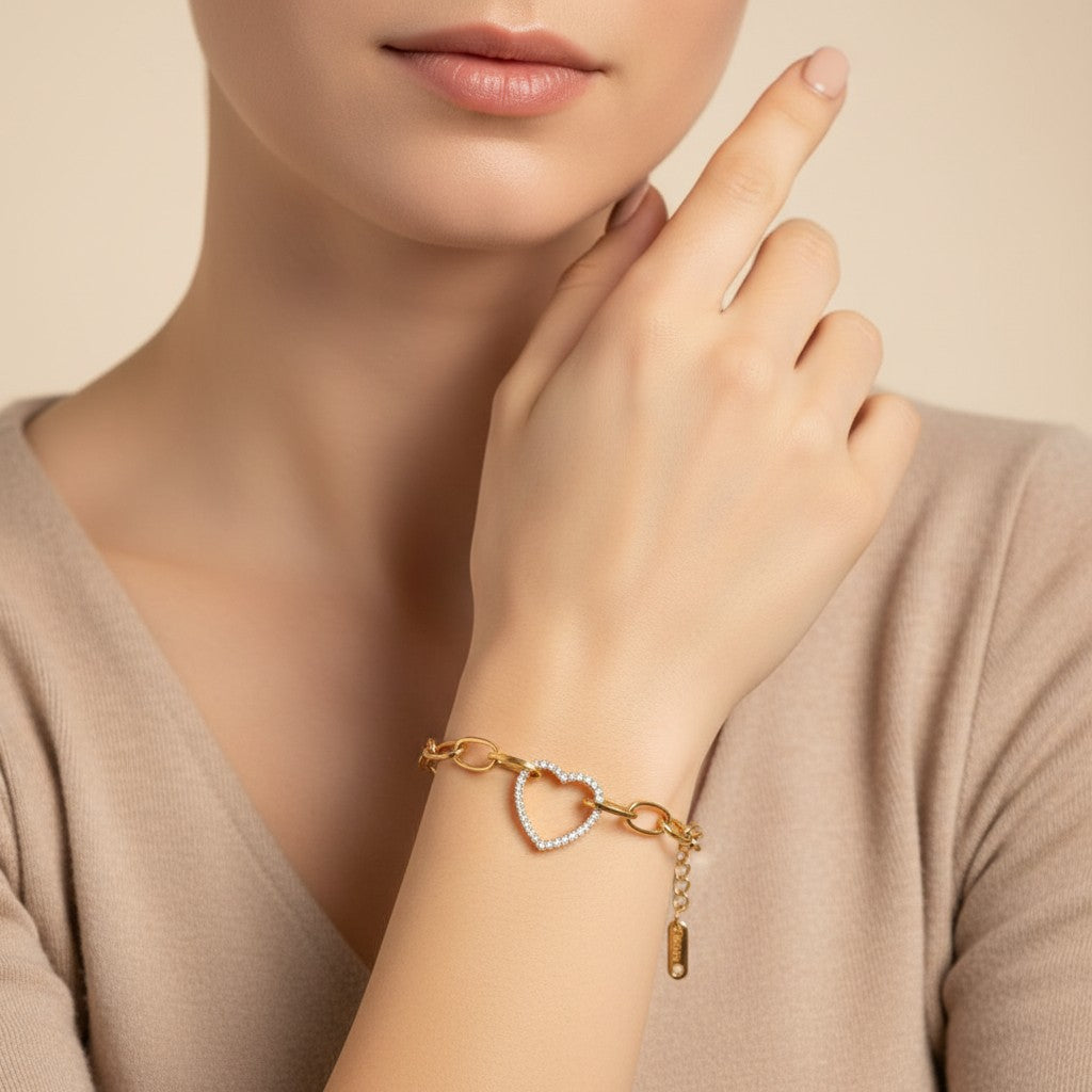 Seraphina Treasures gold-tone stainless steel bracelet with a crystal-encrusted heart pendant and chunky oval links.