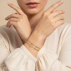 Seraphina Treasures gold-tone two-tier bracelet with beaded chains, cubic zirconia accents, and heart charms.