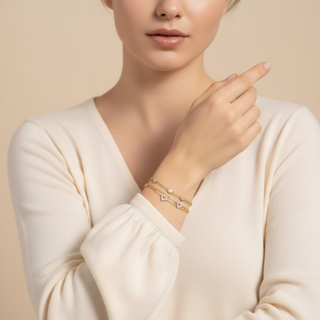 Seraphina Treasures Marcella gold two-tier bracelet with heart charms and clear stones.