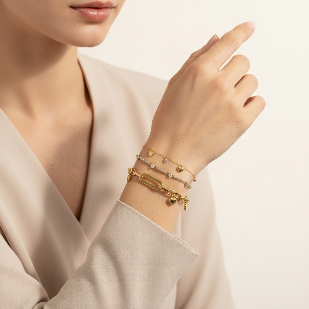 Seraphina Treasures Despoina bracelet set with gold hearts and sparkling zirconia stones on a woman's wrist.
