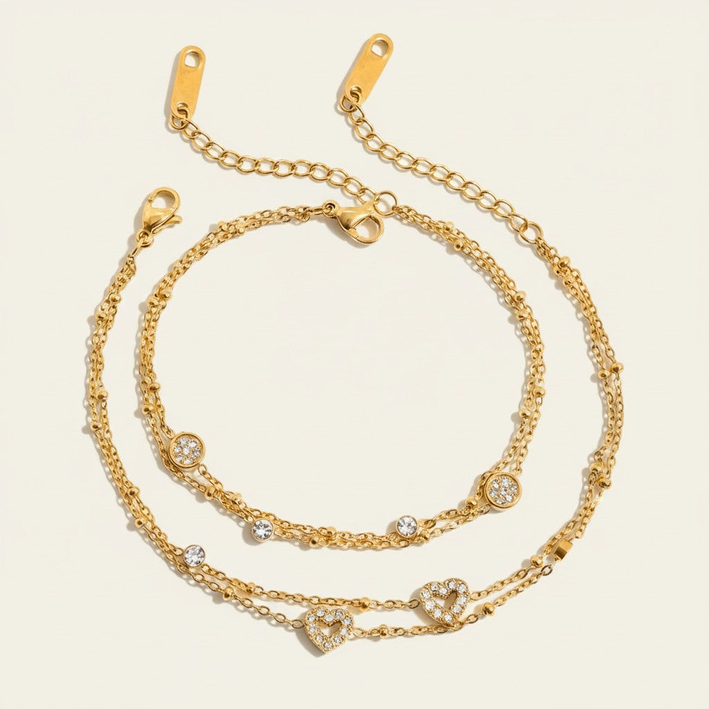 Seraphina Treasures gold-tone two-tier bracelet with beaded chains, cubic zirconia accents, and heart charms.