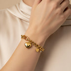 Seraphina Treasures gold chain bracelet with toggle clasp, featuring a large heart pendant and a smaller heart charm with a zircon.