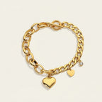 Seraphina Treasures Seren gold-tone bracelet with toggle clasp, featuring heart charms and a zircon accent.