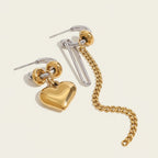 Seraphina Treasures Solarin gold heart dangle earrings with silver chain and clip detail. Elegant, modern design.