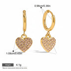 Seraphina Treasures gold hoop earrings with pink crystal-encrusted heart charms. Waterproof and hypoallergenic.
