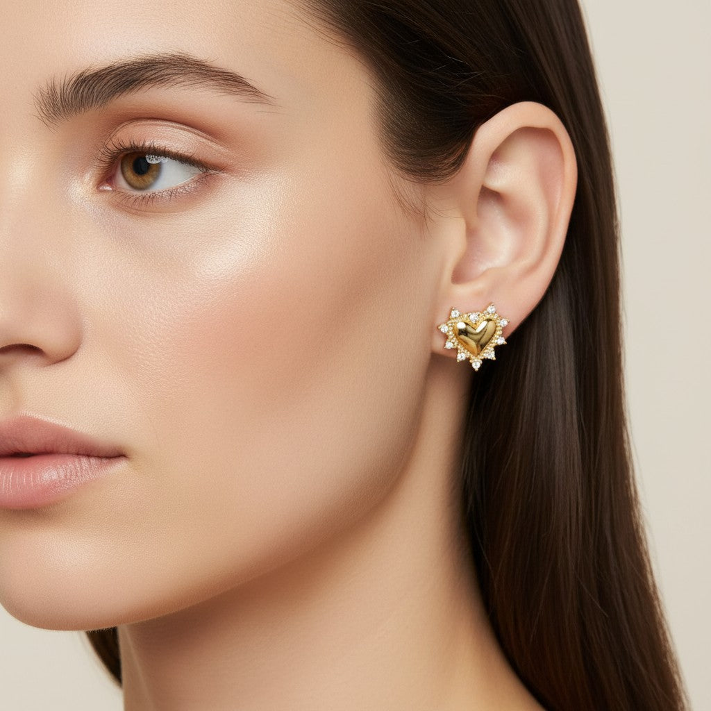 Seraphina Treasures gold heart stud earrings with sparkling stones, detailed border.