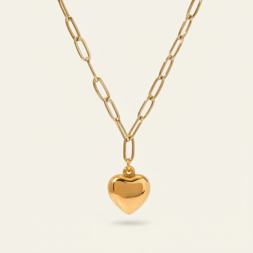 Seraphina Treasures Aureline necklace with a gold heart pendant and silver chain. Elegant, symbolic jewelry.