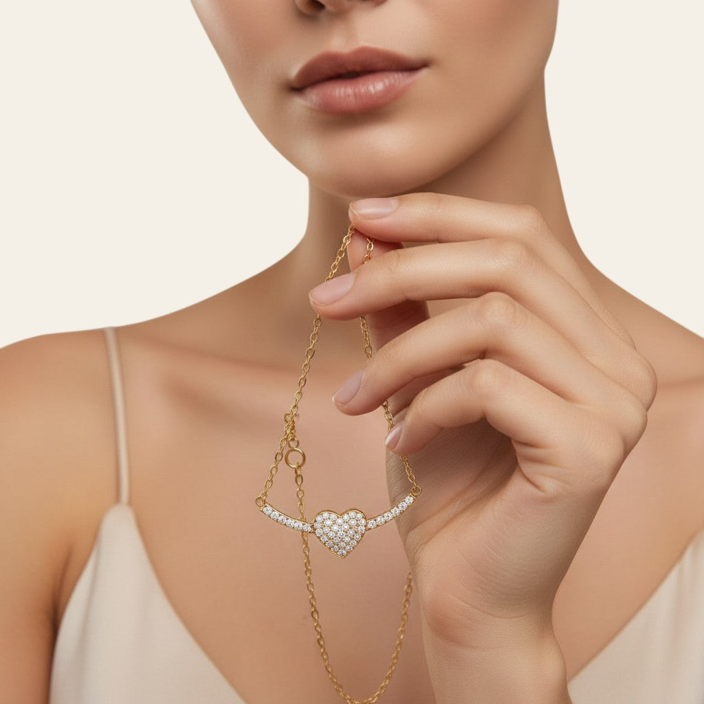 Seraphina Treasures Erebelle gold necklace with a sparkling crystal-encrusted heart pendant and delicate chain.