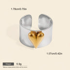 Seraphina Treasures Orvara ring with a gold heart accent on a silver band. Waterproof and hypoallergenic.