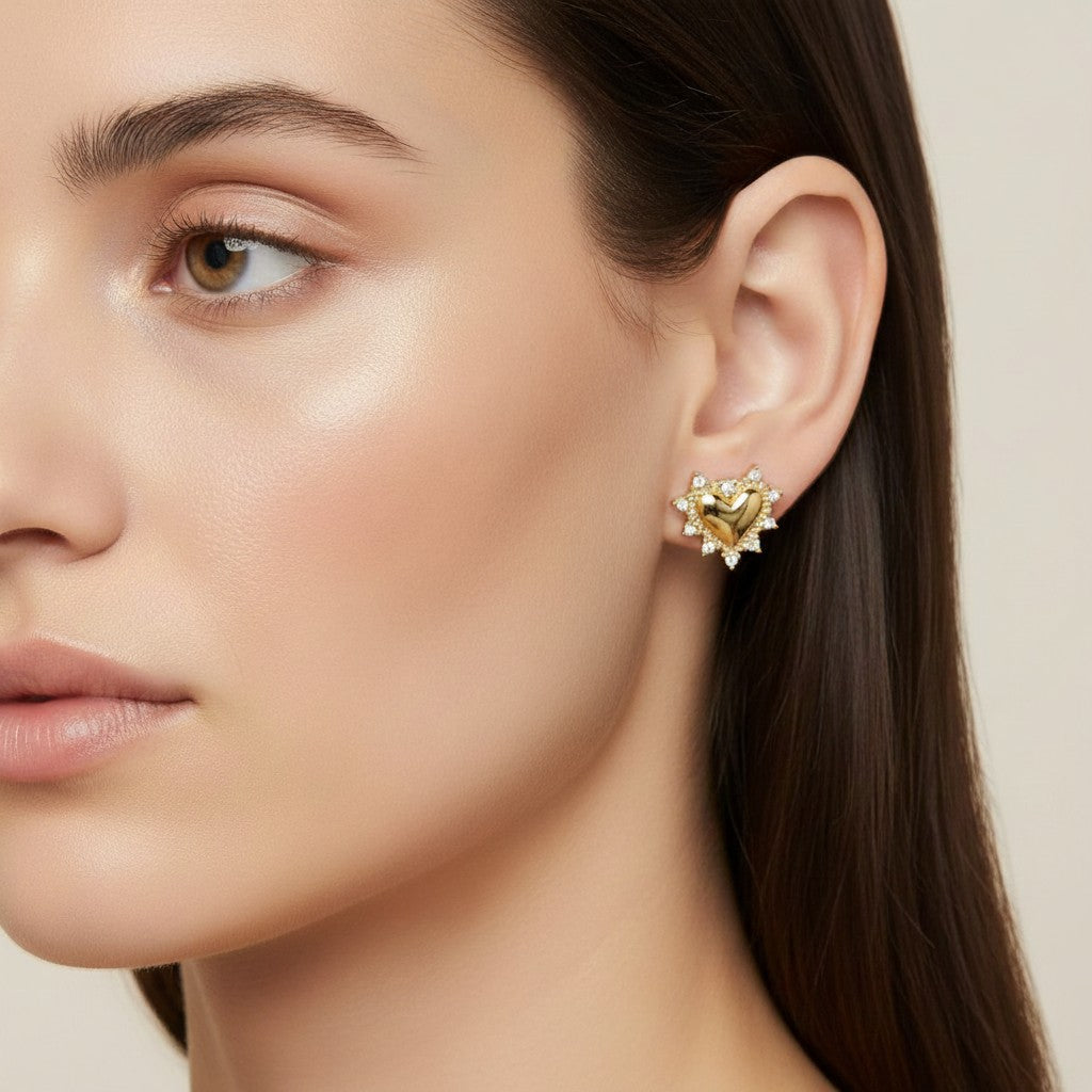 Seraphina Treasures gold heart stud earrings with surrounding clear stones.