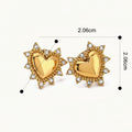 Seraphina Treasures gold heart stud earrings with clear crystal accents, featuring a sunburst-like border.