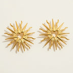 Seraphina Treasures gold hollow heart sunburst stud earrings with delicate rays. Lightweight and romantic.