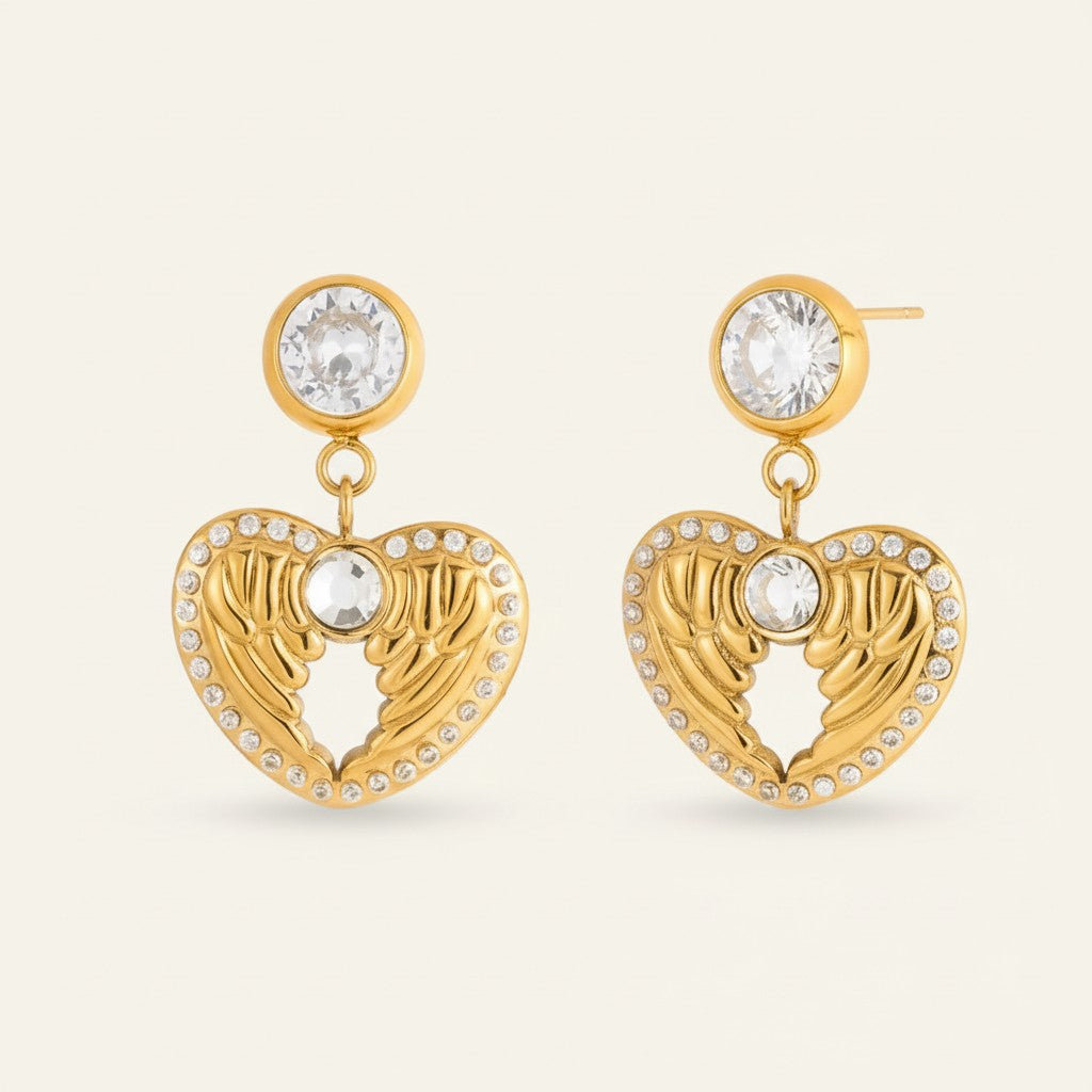 Seraphina Treasures gold heart wing earrings with clear zircon stones. Delicate and elegant.