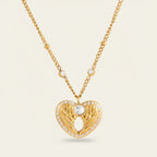 Seraphina Treasures gold heart necklace with wing details and clear zircon stones. A symbol of love and freedom.