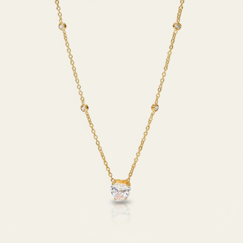 Seraphina Treasures Neith gold necklace with heart-shaped zircon pendant and small accent stones.