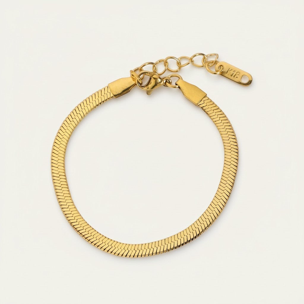 Seraphina Treasures gold herringbone chain bracelet with adjustable clasp and "K18" engraving.