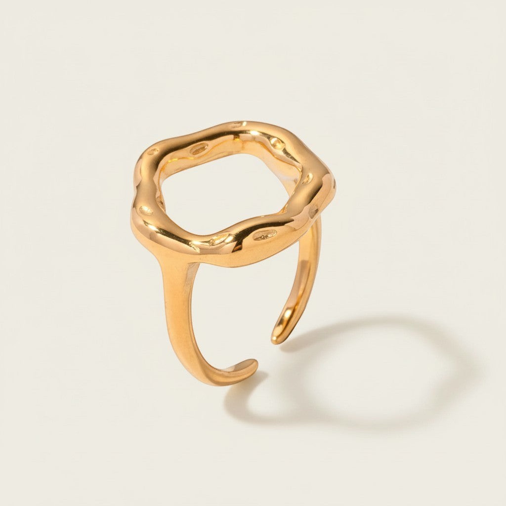 Seraphina Treasures gold hollow flower ring with an abstract, organic shape. Adjustable band for comfortable daily wear.