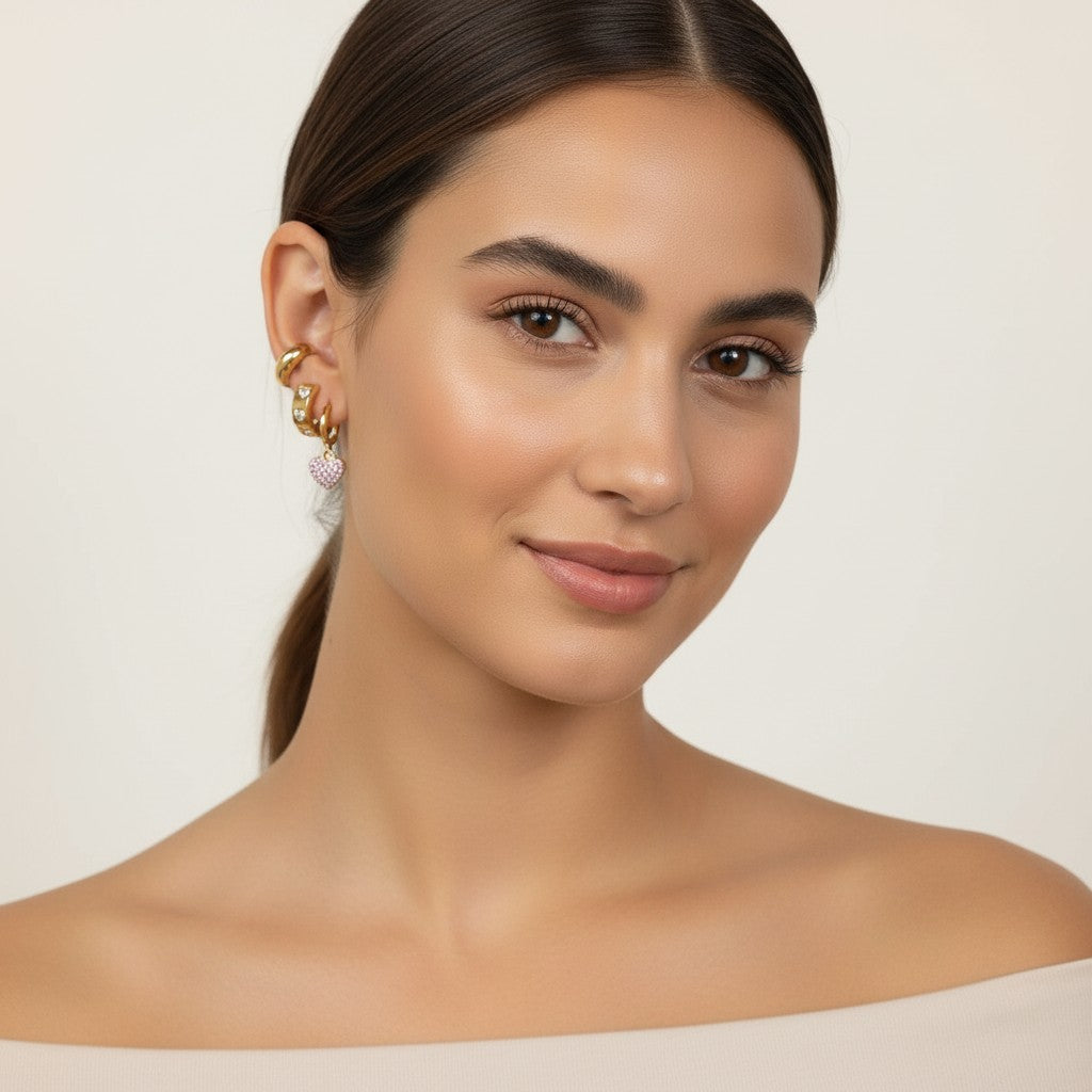 Seraphina Treasures gold hoop earrings with pink heart charm and clear zirconia accents.