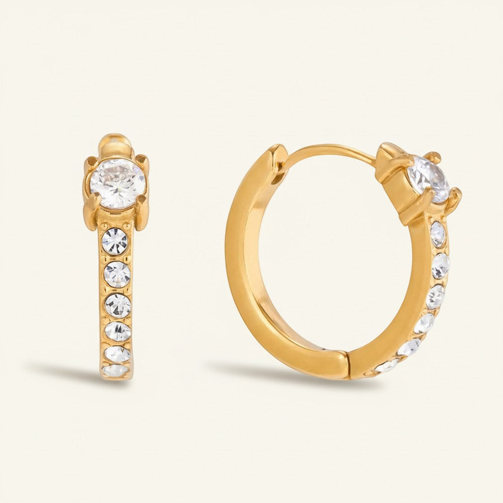Seraphina Treasures gold hoop earrings with clear brilliant-cut stones. Versatile for everyday or special occasions.