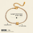 Seraphina Treasures gold-tone tennis bracelet with clear zirconia stones and a gold initial 'K' pendant. Adjustable chain.