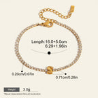 Seraphina Treasures gold-tone tennis bracelet with clear zirconia stones and a gold initial 'S' pendant.