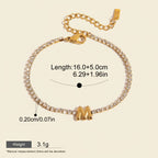 Seraphina Treasures gold-tone bracelet with clear zirconia stones and a gold initial 'M' pendant. Adjustable chain.