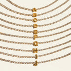 Seraphina Treasures gold tennis bracelet with clear zirconia stones and a gold initial pendant.