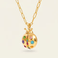 Seraphina Treasures gold ladybug necklace with colorful cubic zirconia stones on a link chain. Whimsical and sparkling.