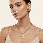 Seraphina Treasures gold ladybug necklace with colorful cubic zirconia stones and a paperclip chain.