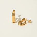 Seraphina Treasures Solisia gold layered oval hoop earrings with post backing.
