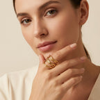 Seraphina Treasures gold-tone metal Drusilla ring with layered, abstract design on a model's finger.