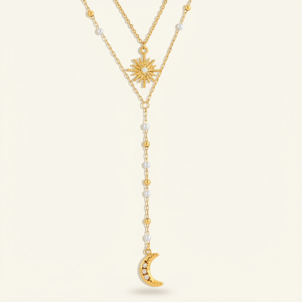Seraphina Treasures gold layered necklace with sun and moon charms, pearl and bead accents, and zircon details.