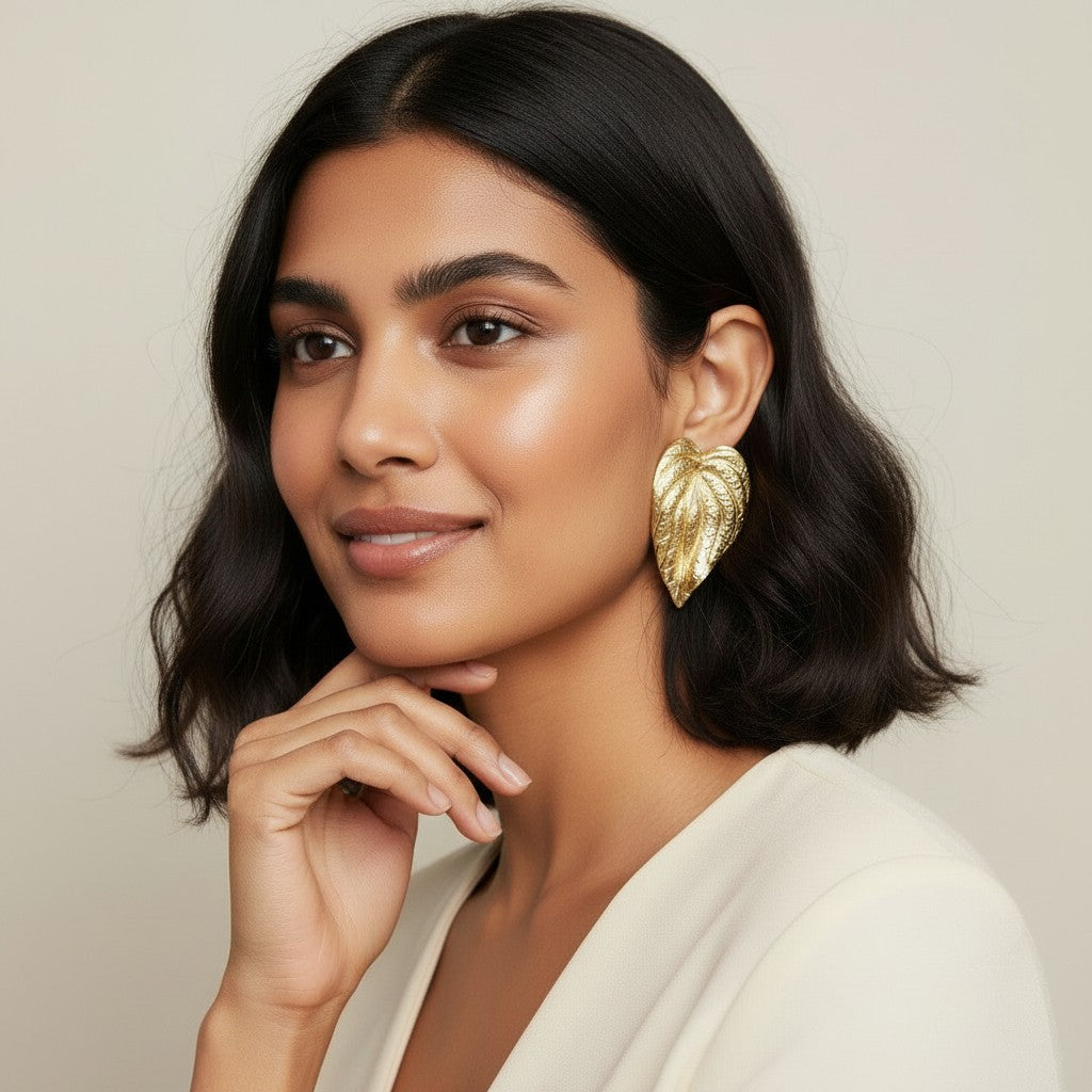 Seraphina Treasures Elowen gold leaf statement earrings with textured detail.
