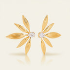Seraphina Treasures gold leaf earrings with pear-cut zircon stones, elegant statement jewelry.