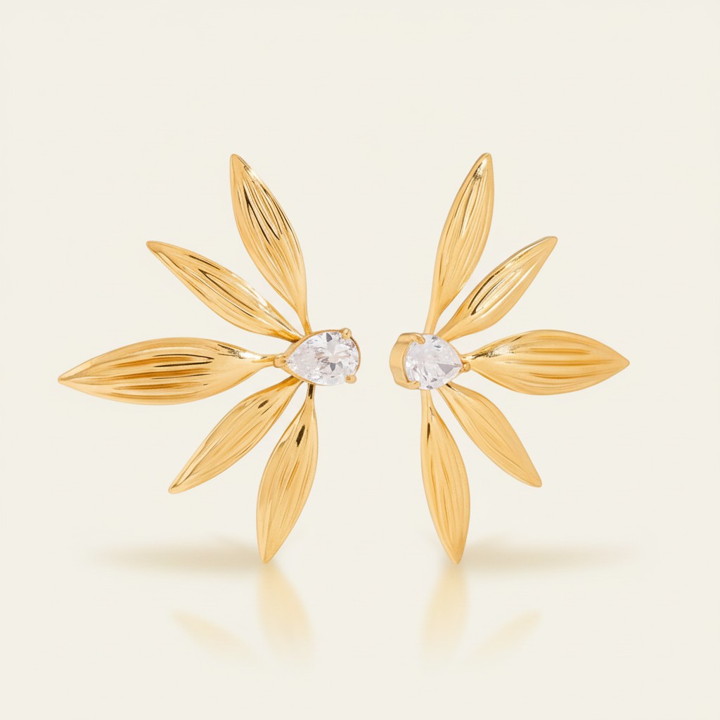 Seraphina Treasures gold leaf earrings with pear-cut zircon stones, elegant statement jewelry.
