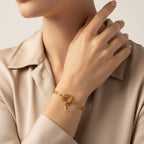 Seraphina Treasures gold-tone chain bracelet with a toggle clasp and a dangling letter L charm. Waterproof and hypoallergenic.