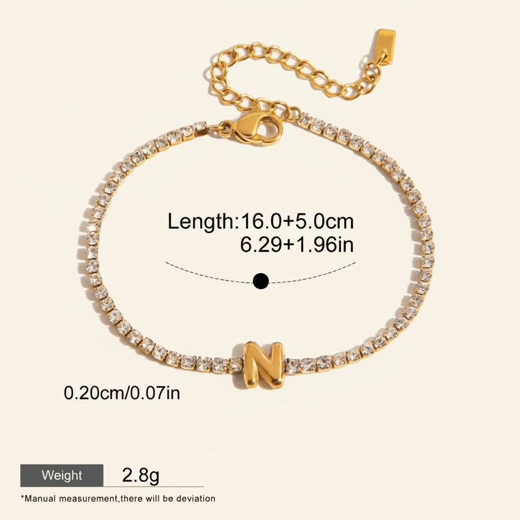 Seraphina Treasures gold-tone bracelet with clear zirconia stones and a gold letter N pendant. Adjustable chain.