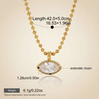 Seraphina Treasures Orpheus gold necklace with a marquise-cut clear zircon pendant and beaded chain. Features an extender.