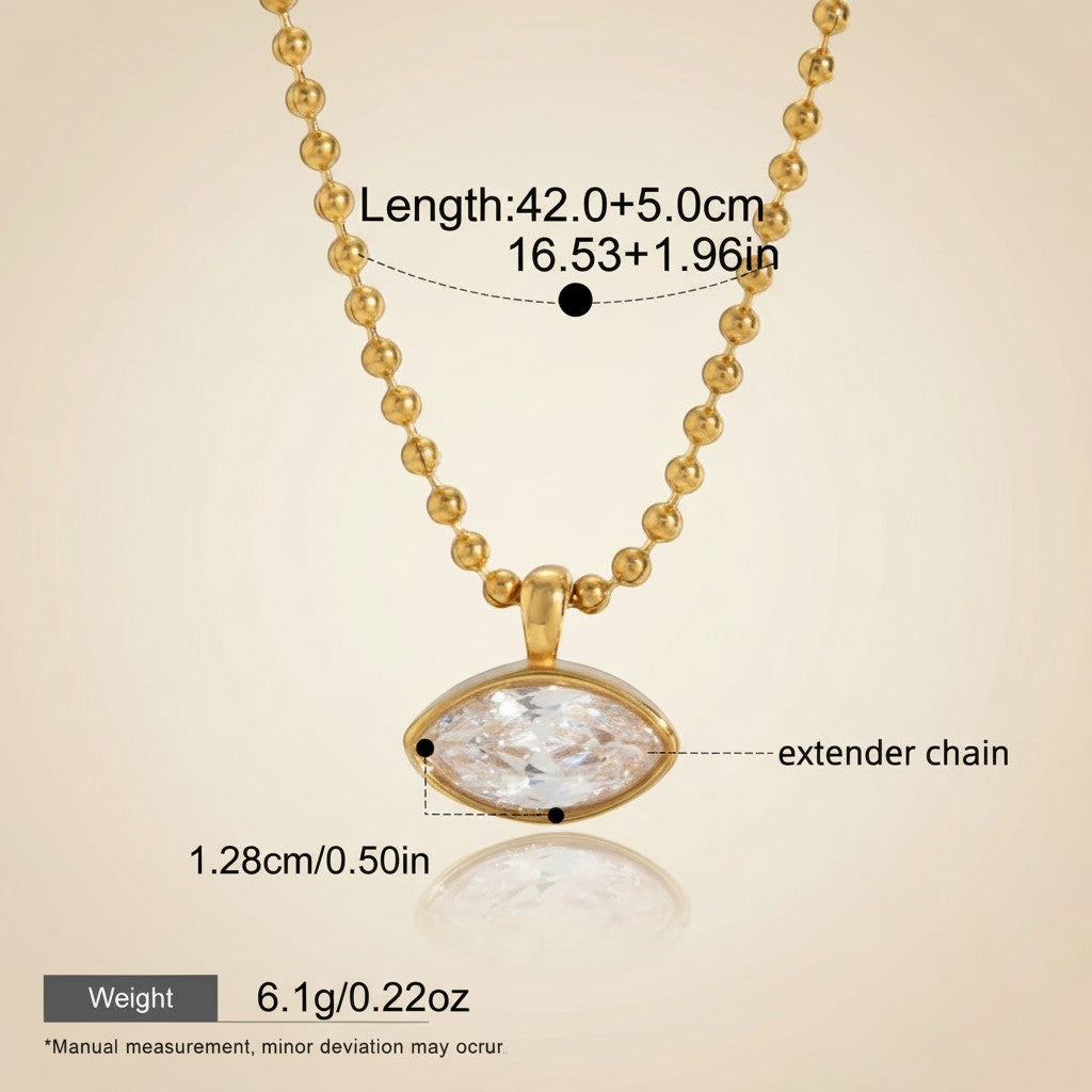Seraphina Treasures Orpheus gold necklace with a marquise-cut clear zircon pendant and beaded chain. Features an extender.