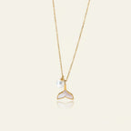 Seraphina Treasures gold necklace with a pearl and a white mermaid tail pendant.