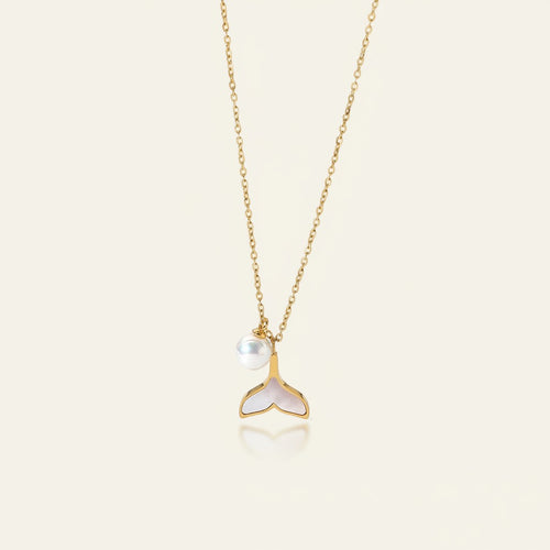 Seraphina Treasures gold necklace with a pearl and a white mermaid tail pendant.