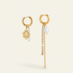 Seraphina Treasures gold-tone mismatched earrings with imitation pearls, crystals, and chain tassels.