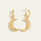 Seraphina Treasures gold crescent moon earrings with crystal accents and a subtle face detail.