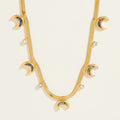 Seraphina Treasures gold serpentine chain necklace with crescent moon and crystal pendants.