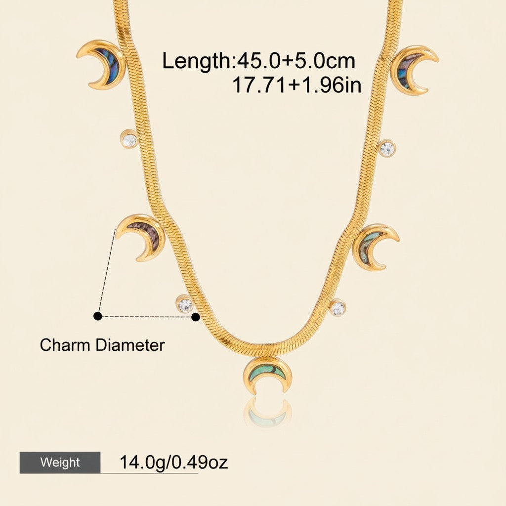 Seraphina Treasures gold serpentine chain necklace with crescent moon and crystal pendants. Adjustable length.