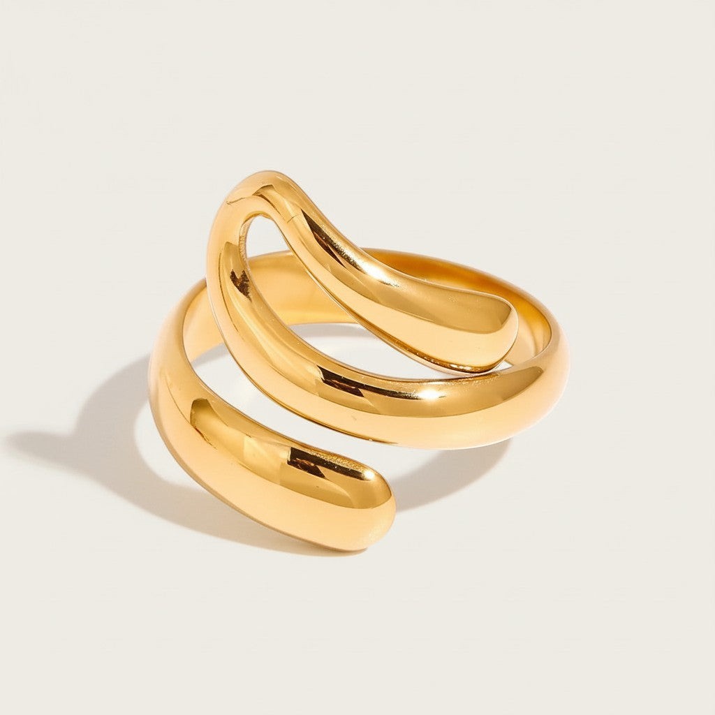Seraphina Treasures gold-tone metal Ondara ring with a hollow, coiled design and smooth lines.
