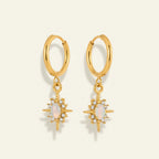 Seraphina Treasures Orphielle gold drop earrings with iridescent opal and clear zirconia starburst.