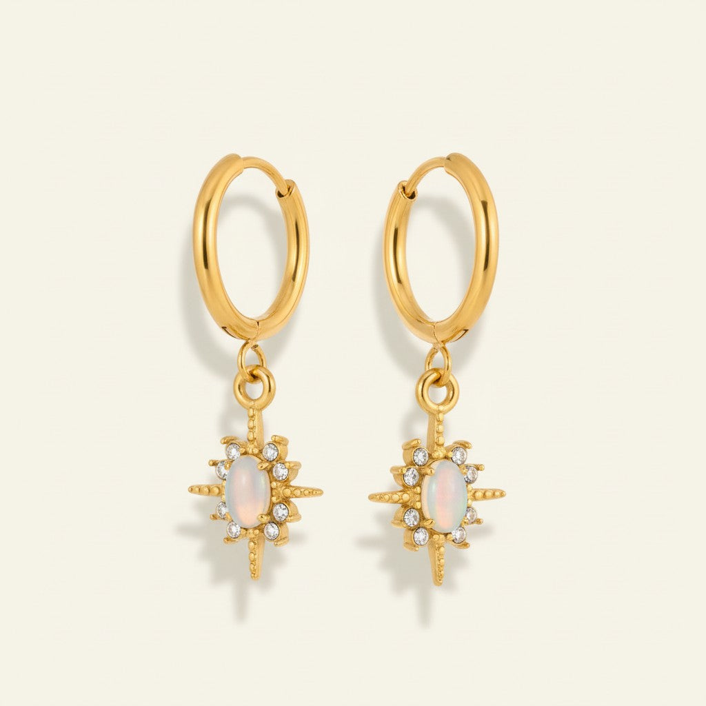 Seraphina Treasures Orphielle gold drop earrings with iridescent opal and clear zirconia starburst.
