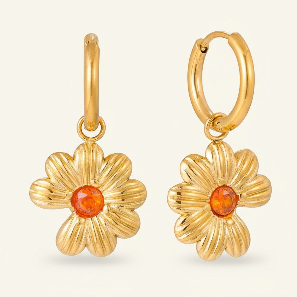 Seraphina Treasures gold flower hoop earrings with orange cubic zirconia center. Nature-inspired floral design.