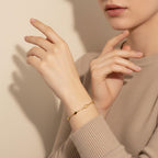 Seraphina Treasures Niobe gold-tone stainless steel bracelet with oval links and adjustable chain.